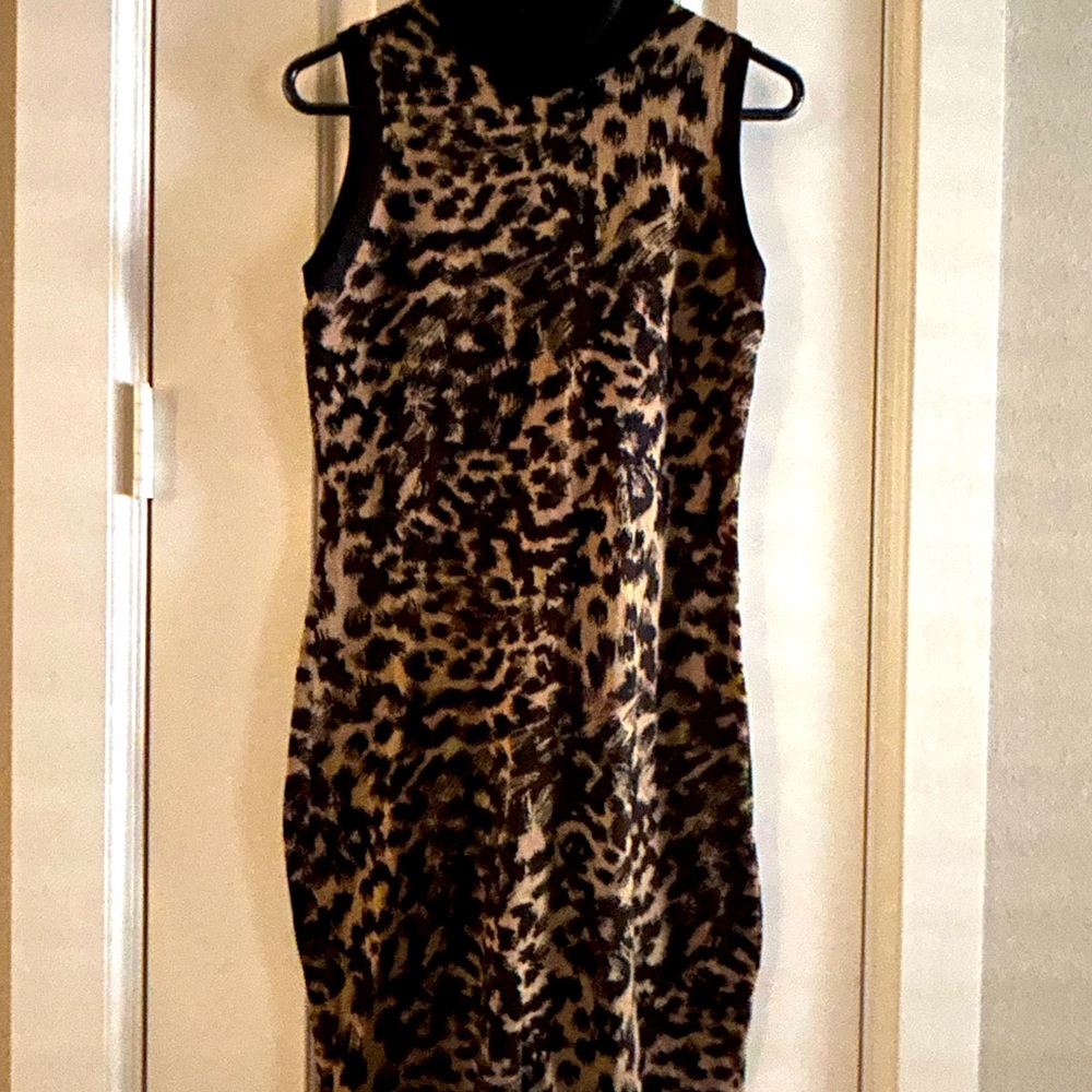 Love this dress from Calvin Klein, a sleeveless sweater dress w turtle neck